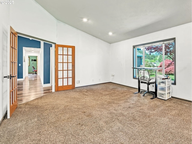 39225 SW Oak Ln, Willamina, OR 97396 - empty room with french doors, carpet floors, vaulted ceiling, baseboards, and recessed lighting