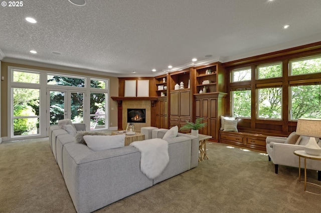 living area with recessed lighting and light colored carpet