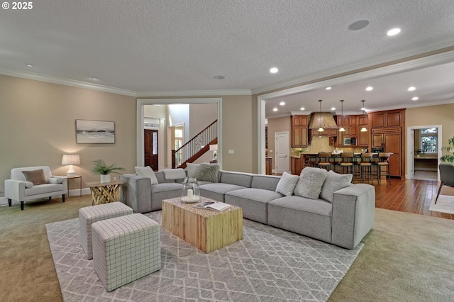 living room with recessed lighting, light colored carpet, and ornamental molding