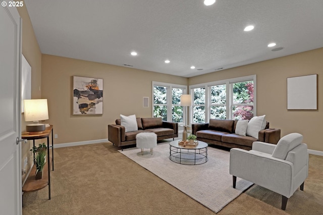living room featuring baseboards, light carpet, and recessed lighting