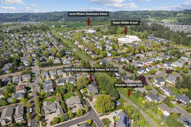 birds eye view of property with a residential view