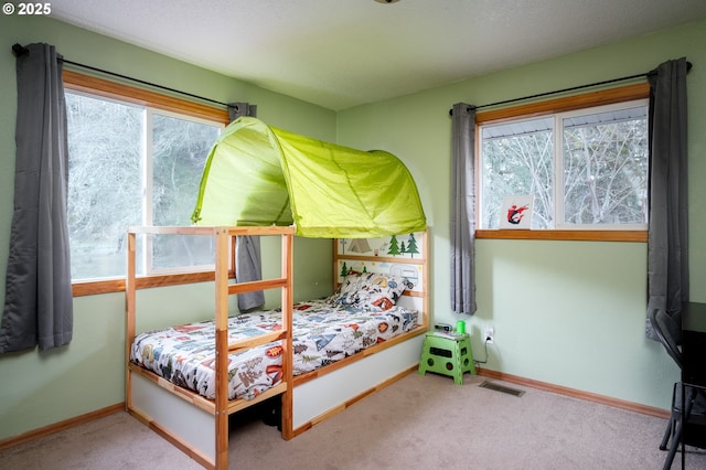 bedroom featuring carpet