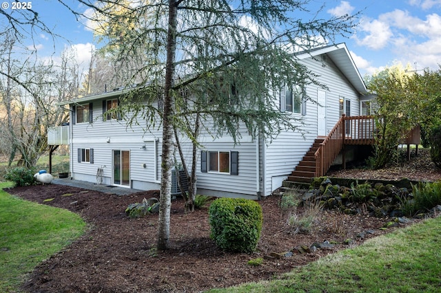 rear view of house with a deck