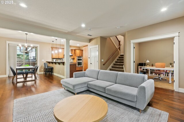 4520 Trillium, Woods, Lake Oswego, OR 97035 - living room featuring dark wood-style floors, an office area, stairway, recessed lighting, and a chandelier