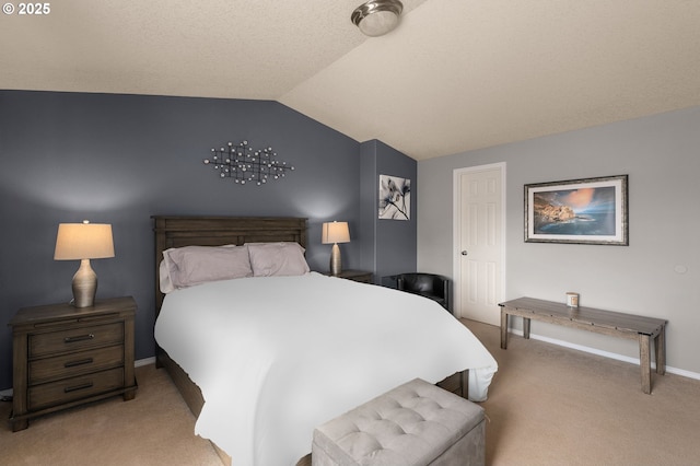 carpeted bedroom featuring lofted ceiling and baseboards