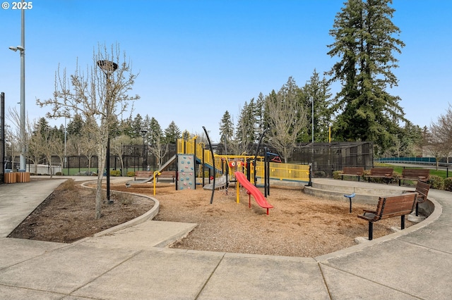 community jungle gym featuring fence