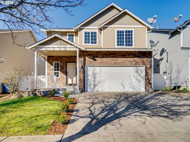 view of front of home with a porch, a front yard, a garage, stone siding, and driveway