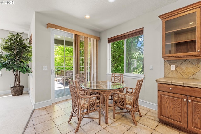 11168 SW Brown St, Tualatin, OR 97062 - dining room with baseboards, light tile patterned floors, and recessed lighting