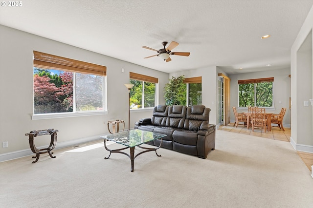 11168 SW Brown St, Tualatin, OR 97062 - living area featuring healthy amount of natural light, a ceiling fan, light carpet, baseboards, and recessed lighting
