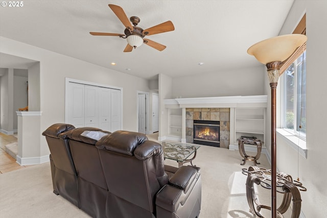 11168 SW Brown St, Tualatin, OR 97062 - living area featuring a ceiling fan, a tiled fireplace, light colored carpet, recessed lighting, and baseboards
