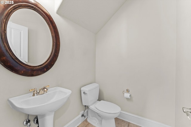 11168 SW Brown St, Tualatin, OR 97062 - half bath with baseboards, lofted ceiling, tile patterned floors, toilet, and a sink