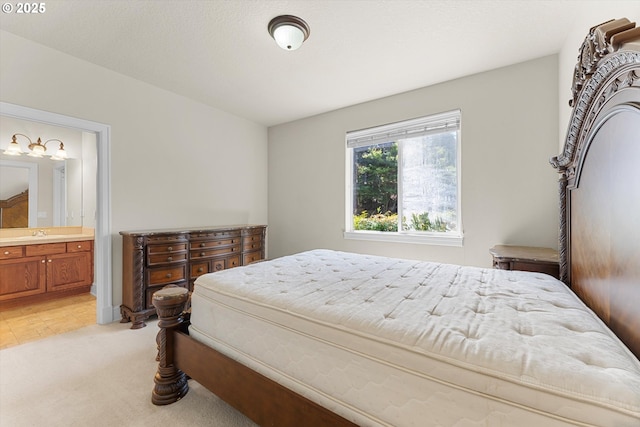 11168 SW Brown St, Tualatin, OR 97062 - bedroom with light colored carpet, ensuite bathroom, and a sink
