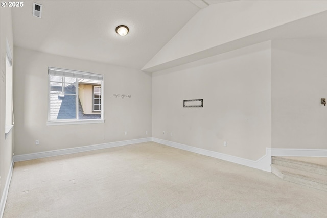 11168 SW Brown St, Tualatin, OR 97062 - empty room featuring carpet floors, vaulted ceiling, and baseboards