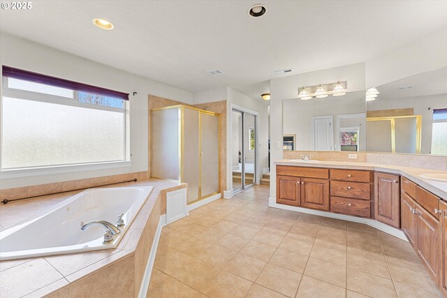 11168 SW Brown St, Tualatin, OR 97062 - bathroom with a shower stall, double vanity, a tub with jets, and tile patterned flooring