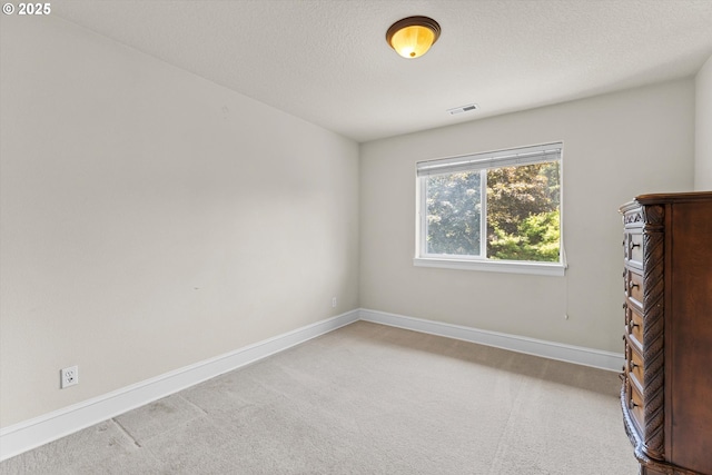 11168 SW Brown St, Tualatin, OR 97062 - carpeted empty room featuring baseboards and a textured ceiling