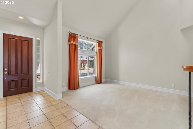 11168 SW Brown St, Tualatin, OR 97062 - entryway featuring high vaulted ceiling, light carpet, baseboards, light tile patterned floors, and recessed lighting