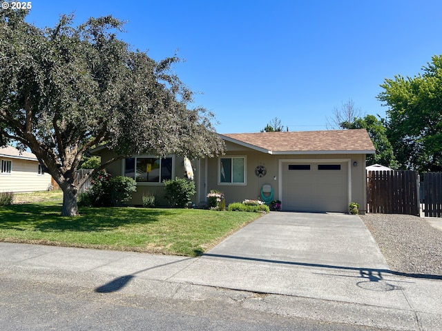 160 Heather Dr, Stanfield, OR 97875 - ranch-style home with an attached garage, concrete driveway, and roof with shingles
