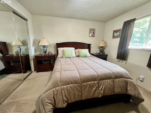 160 Heather Dr, Stanfield, OR 97875 - bedroom with carpet flooring, a closet, and a textured ceiling