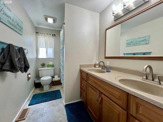 160 Heather Dr, Stanfield, OR 97875 - full bath with toilet, double vanity, tile patterned flooring, a textured wall, and curtained shower