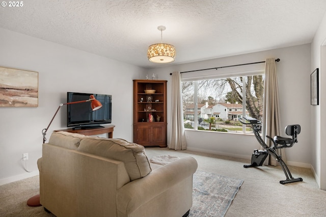 carpeted living room featuring a textured ceiling