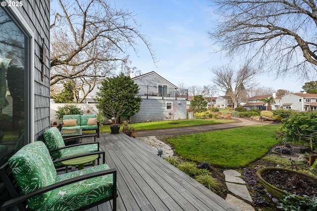 deck featuring an outdoor hangout area and a lawn