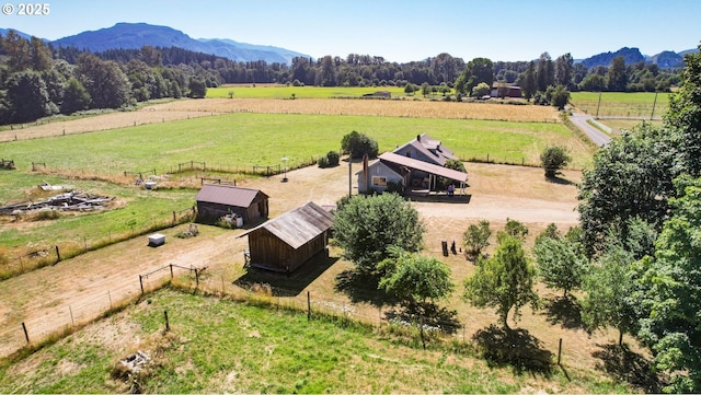 drone / aerial view featuring a mountain view and a rural view