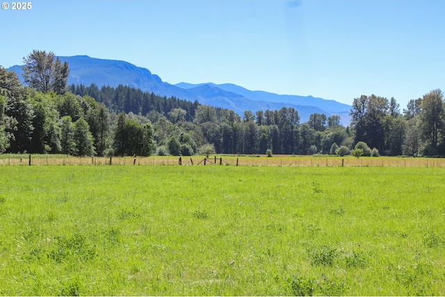 mountain view featuring a rural view