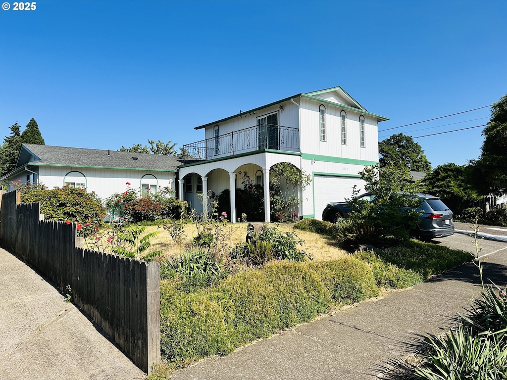 2133 15th St, Springfield, OR 97477 - view of front of property featuring a balcony, an attached garage, and driveway