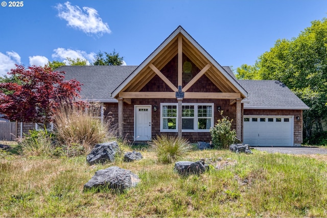 1430 N Cedar Creek Cir, Rockaway Beach, OR 97136 - view of front of home featuring a shingled roof, an attached garage, and driveway