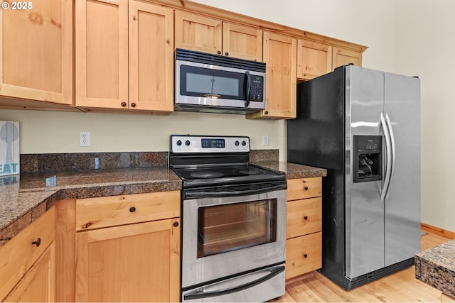 1430 N Cedar Creek Cir, Rockaway Beach, OR 97136 - kitchen with stainless steel appliances, tile countertops, light brown cabinetry, and light wood-style flooring
