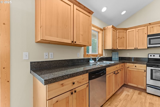 1430 N Cedar Creek Cir, Rockaway Beach, OR 97136 - kitchen with stainless steel appliances, light brown cabinetry, vaulted ceiling, light wood finished floors, and recessed lighting