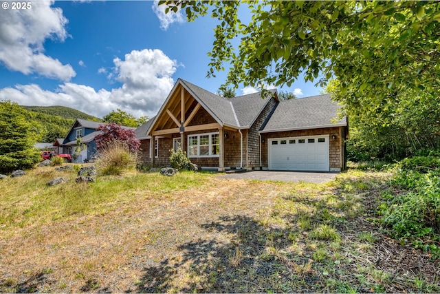 1430 N Cedar Creek Cir, Rockaway Beach, OR 97136 - view of front facade with a garage, driveway, and roof with shingles