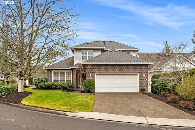 front of property with a front yard and a garage