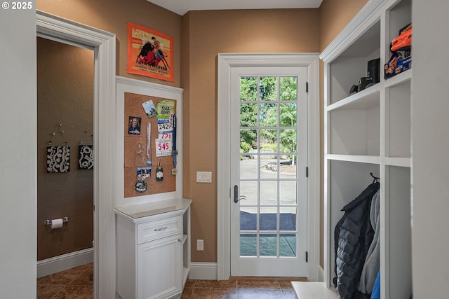 3545 Eagle Crest Rd NW, Salem, OR 97304 - doorway with baseboards and dark tile patterned flooring