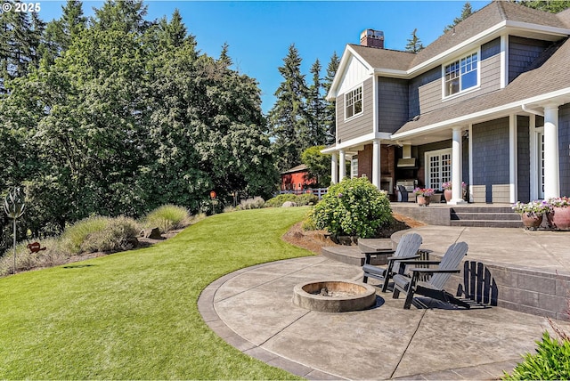 3545 Eagle Crest Rd NW, Salem, OR 97304 - view of green lawn featuring an outdoor fire pit and a patio