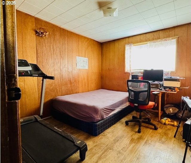 703 Y Ave, La Grande, OR 97850 - bedroom featuring wood finished floors and wooden walls