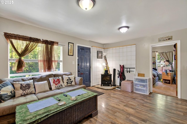 1224 Coal Creek Rd, Longview, WA 98632 - living room with a wood stove, healthy amount of natural light, and wood finished floors