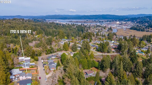 1751 S 19th St, Coos Bay, OR 97420 - bird's eye view featuring a view of trees, a residential view, and a mountain view