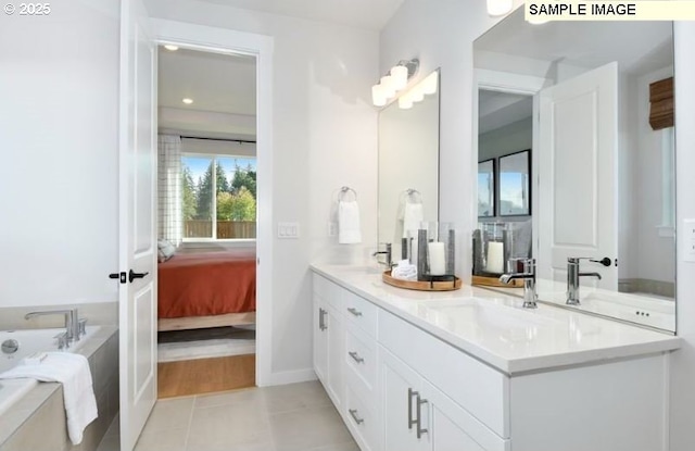 bathroom with tile patterned flooring and vanity