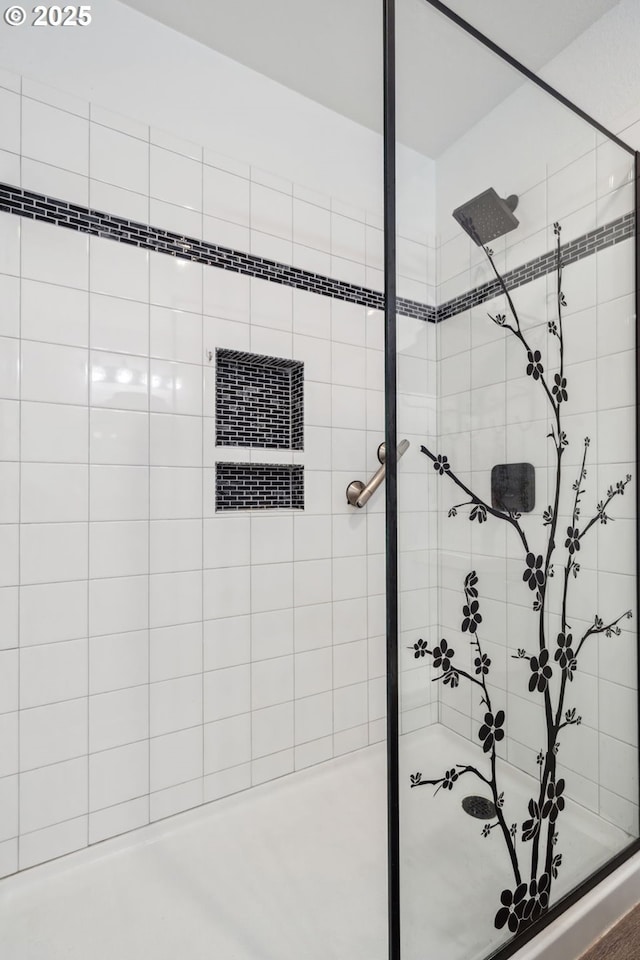 full bath featuring a shower stall