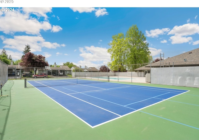 view of sport court with fence