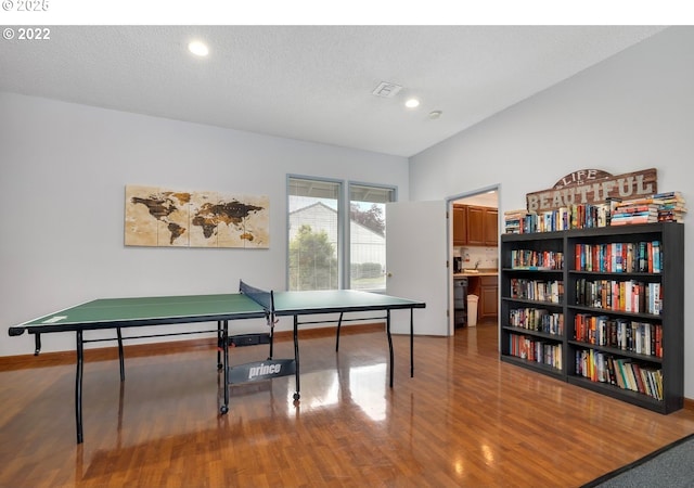 rec room with recessed lighting and wood finished floors