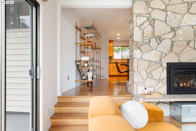 2345 NE Ridgewood Dr, Portland, OR 97212 - living area with wood finished floors, stairs, and a fireplace