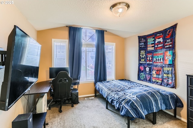 bedroom with carpet floors, baseboards, vaulted ceiling, and a textured ceiling