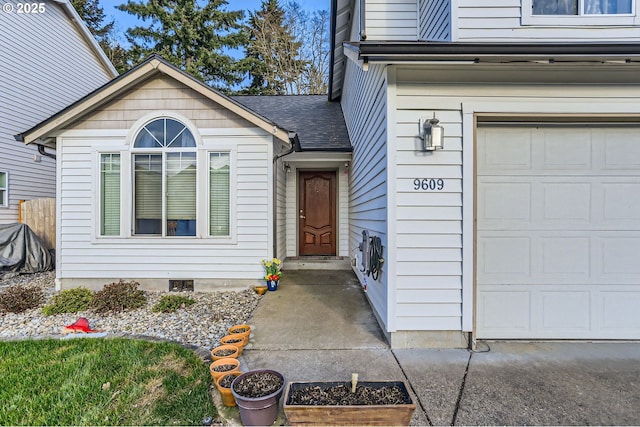 doorway to property featuring roof with shingles