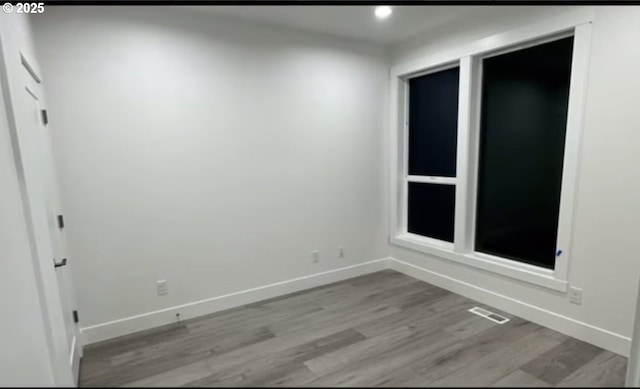 spare room featuring visible vents, recessed lighting, baseboards, and light wood-type flooring