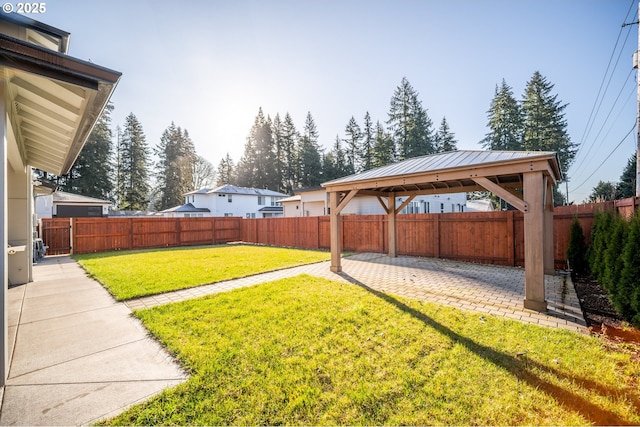 view of yard with a gazebo, a patio area, and a fenced backyard