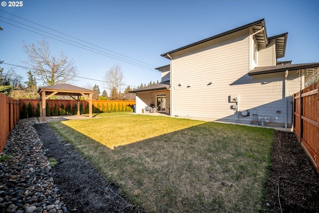 view of yard with a gazebo, a fenced backyard, and a patio