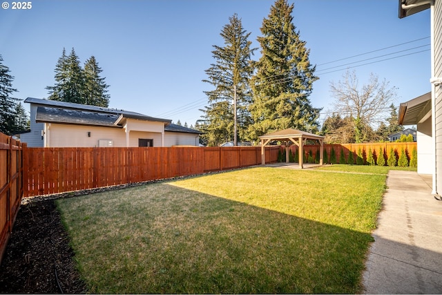 view of yard with a gazebo and a fenced backyard