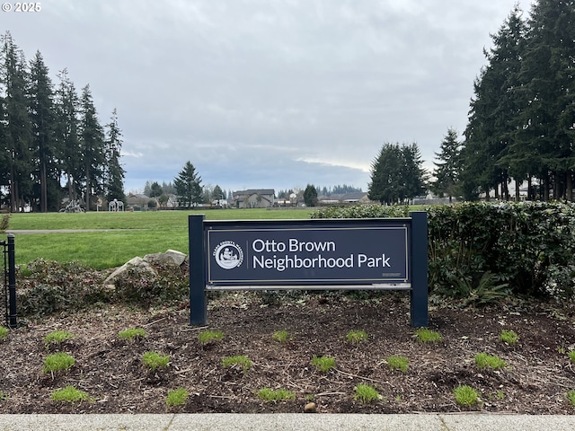 view of home's community with a lawn